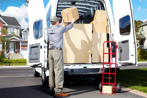 Worker checking items and using correct lifting care