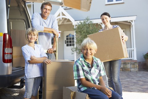 Professional movers handling furniture in a Battersea apartment building