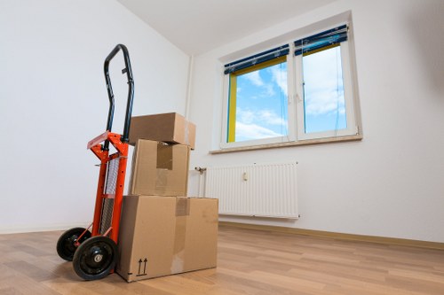 Boxes and workspace items ready for transport during a Battersea business relocation