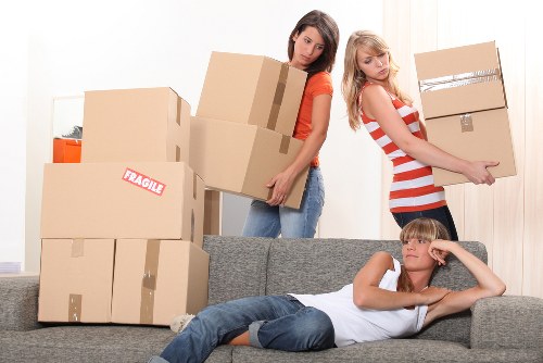 Local moving team organising boxes in Battersea property access